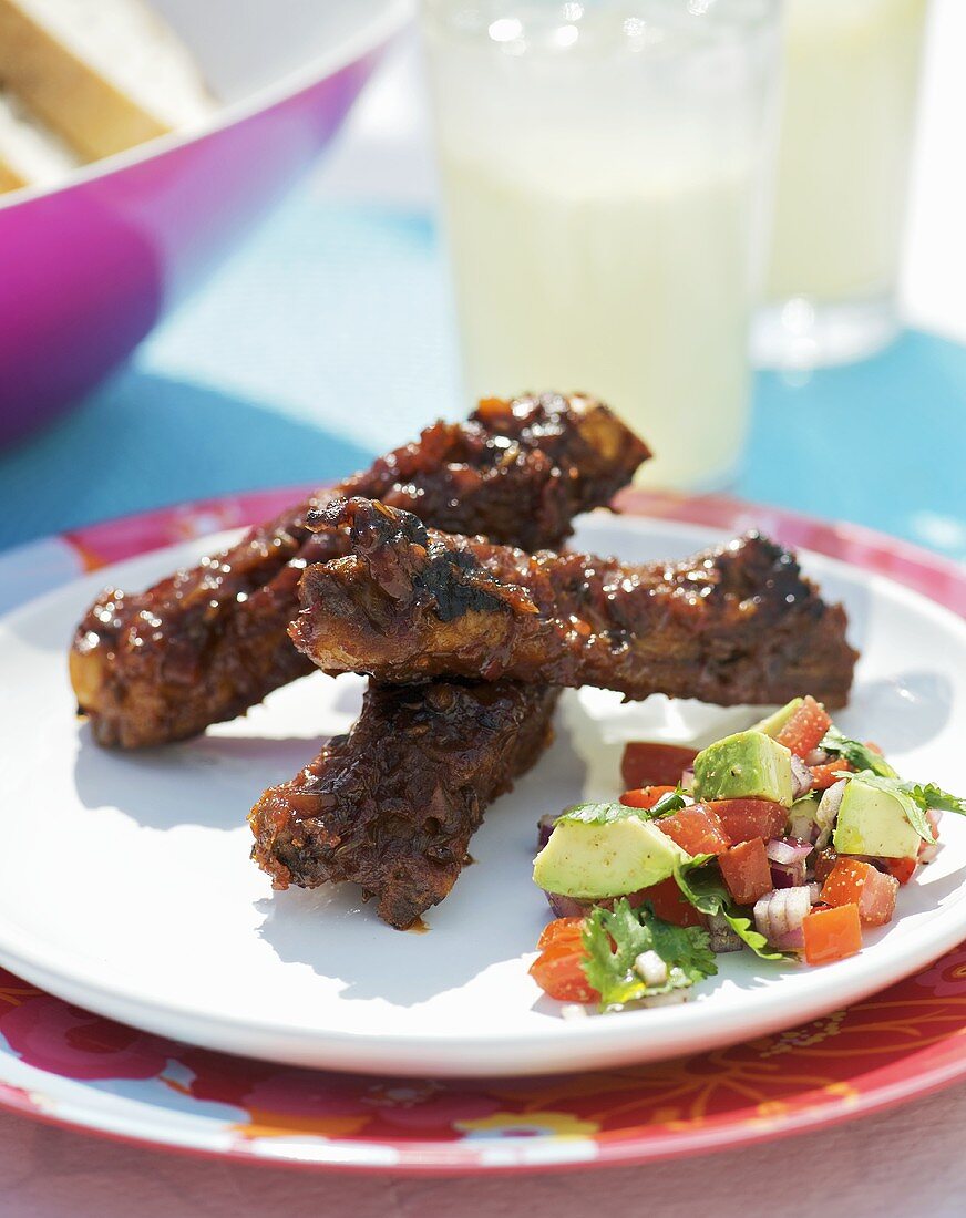 Grilled spare ribs with tomato and avocado salsa