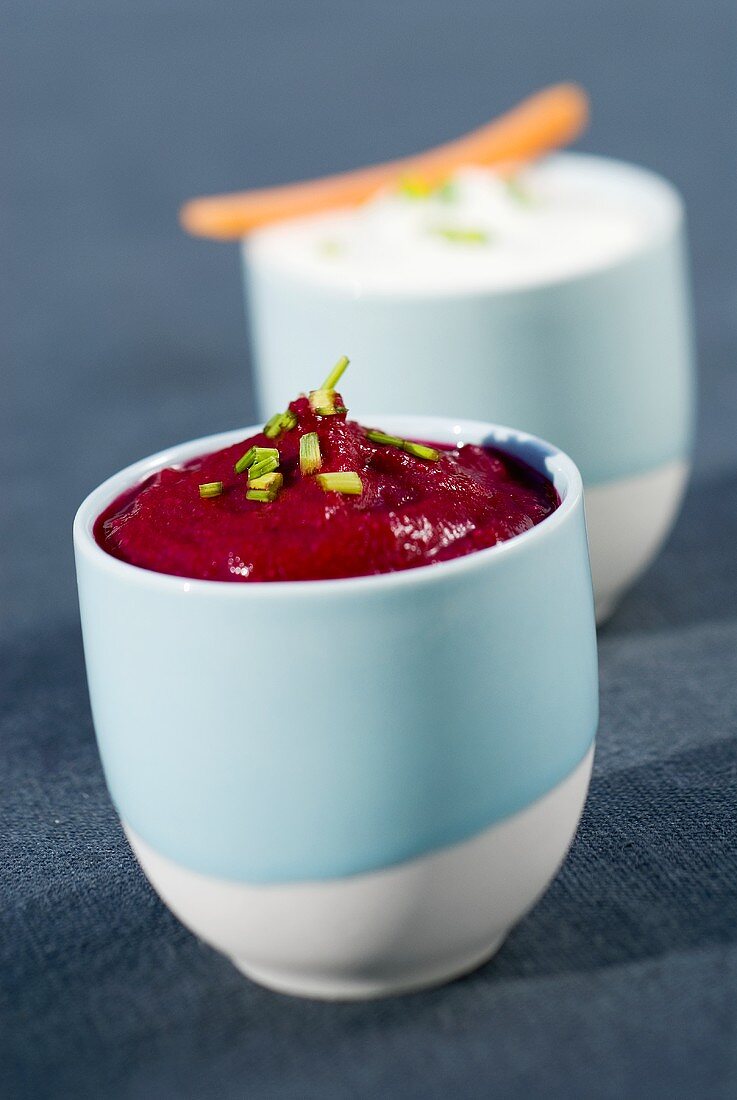 Beetroot and sour cream dips in two pots