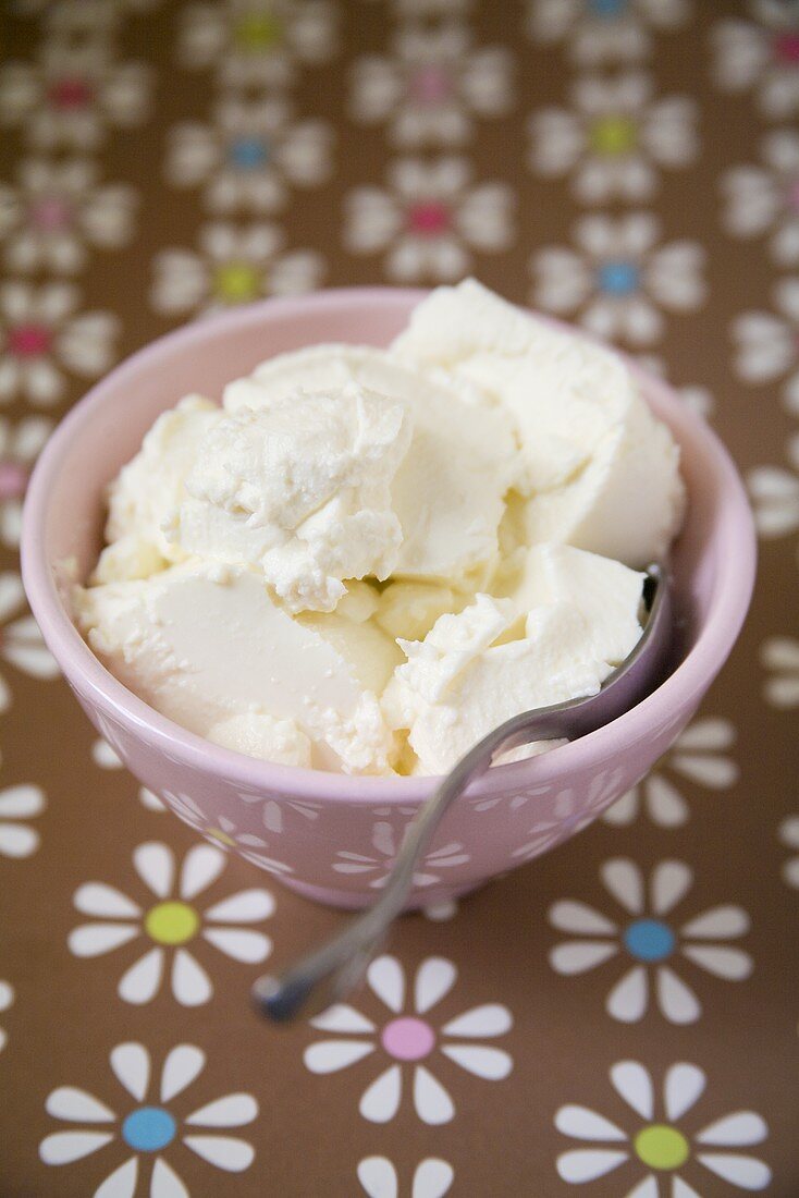Ricotta in a bowl with a spoon