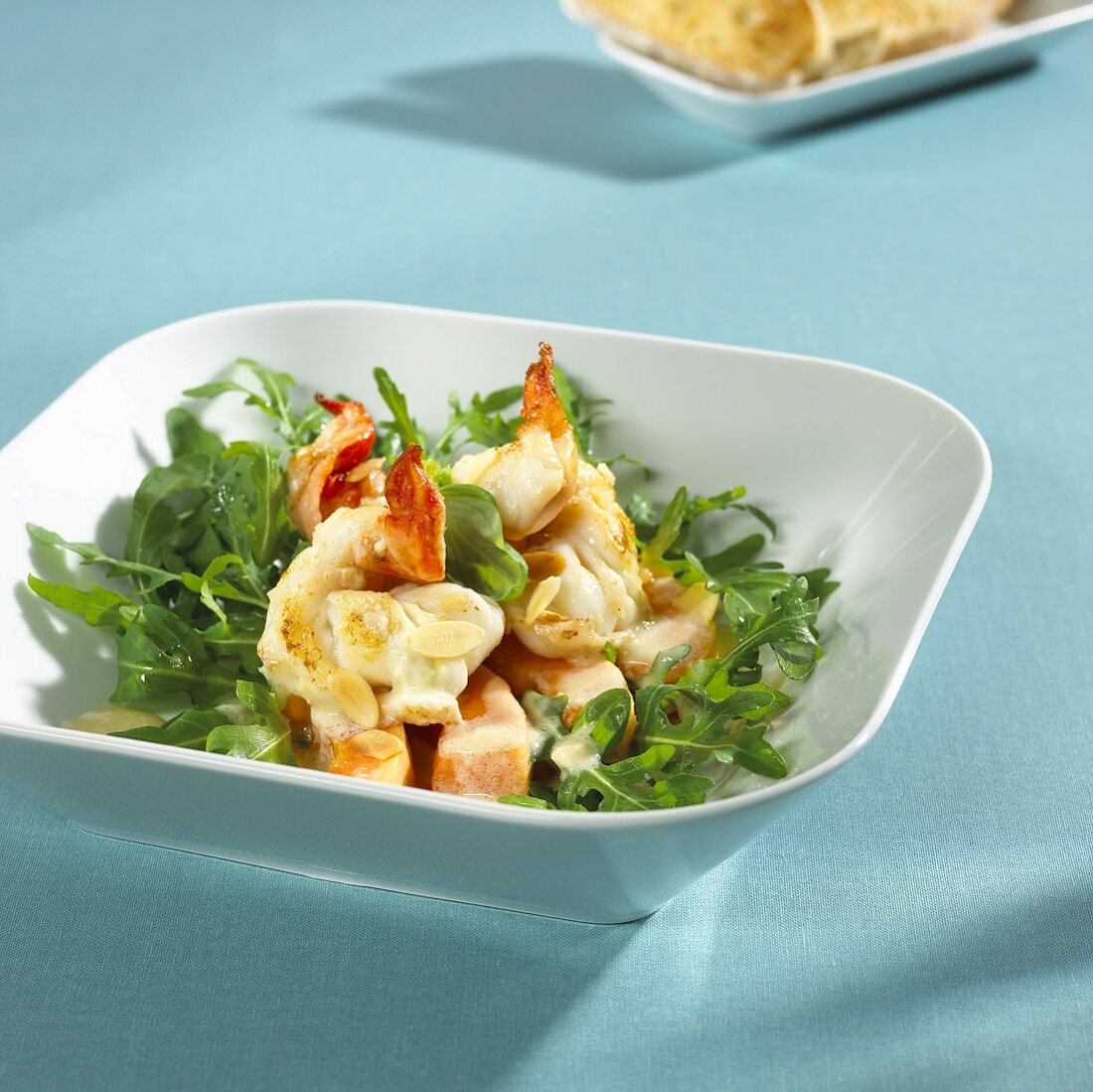 Fried prawns and papaya on rocket, buttermilk dressing