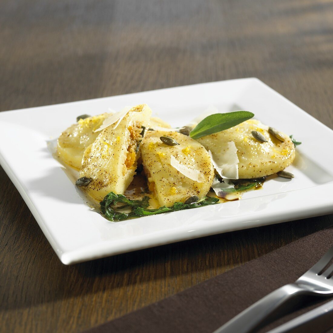 Potato & pumpkin ravioli with sage butter, rocket, Parmesan