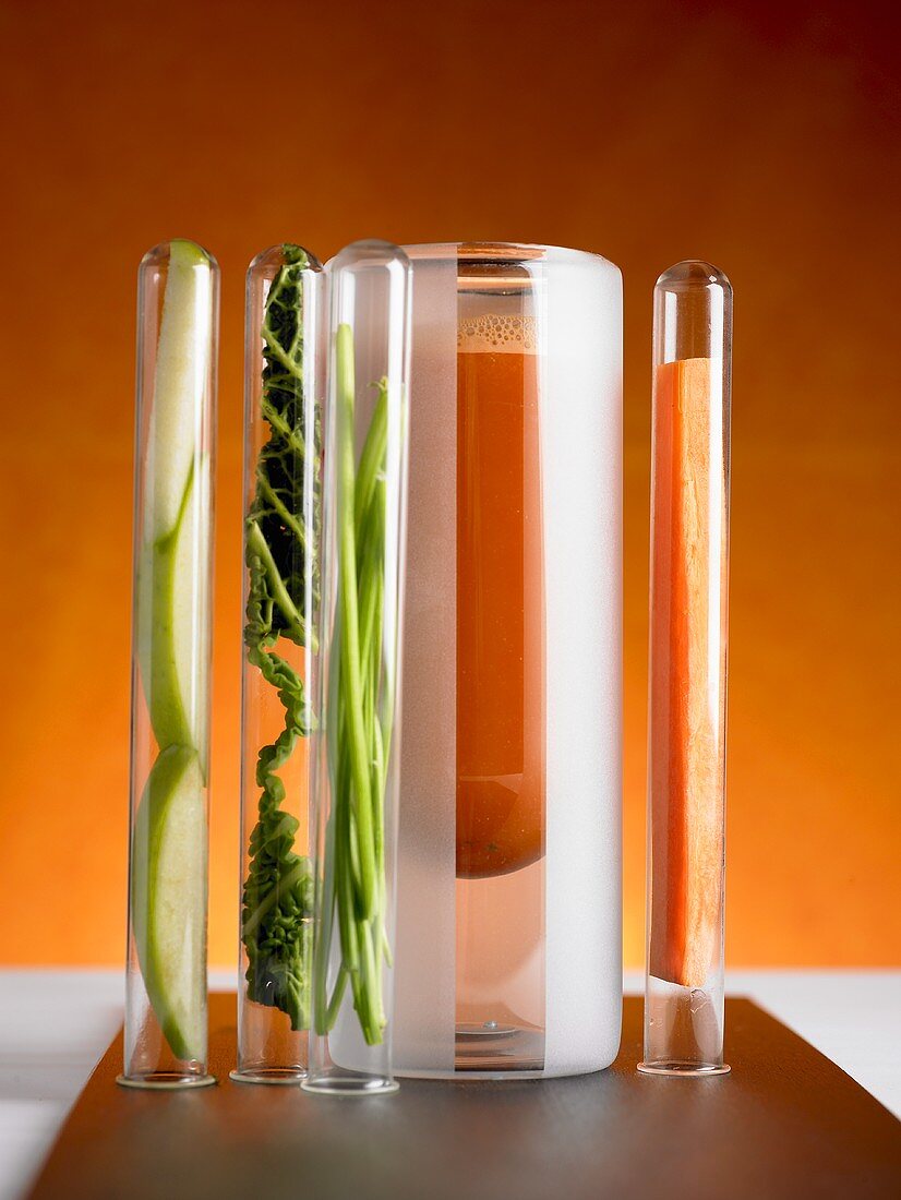 Multivitamin juice with ingredients in test tubes