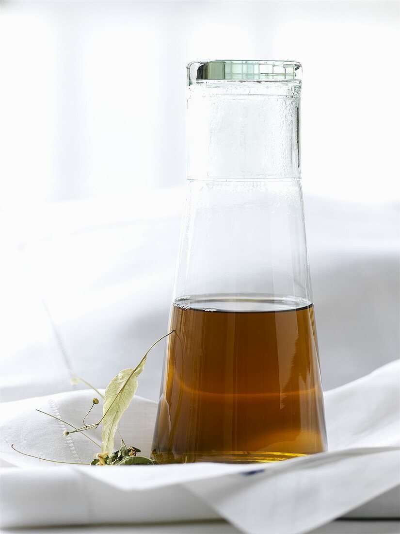 Lime blossom tea in a glass bottle