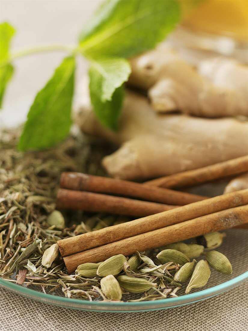 Ginger, cinnamon, cardamom and herbs to make tea