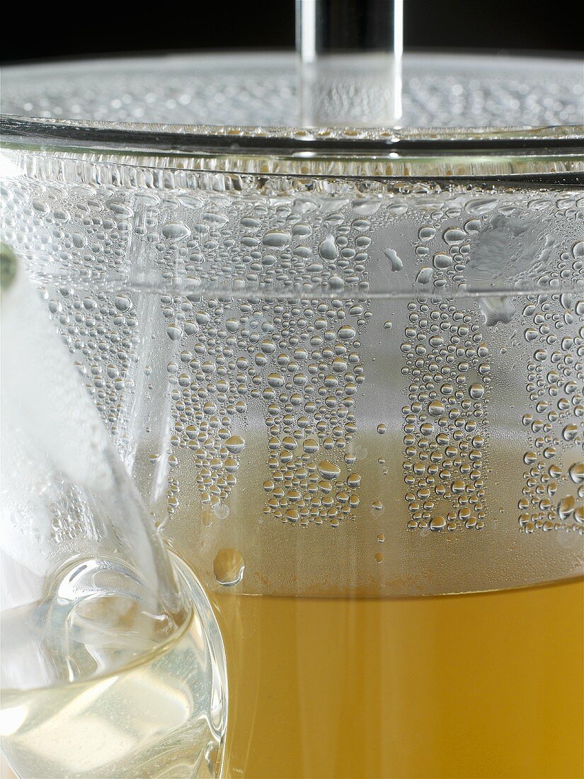 Glass pot of herbal tea