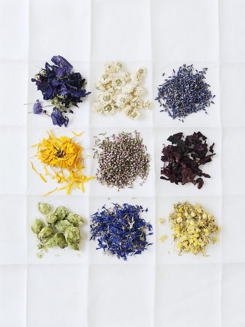 Various dried medicinal flowers on a cloth