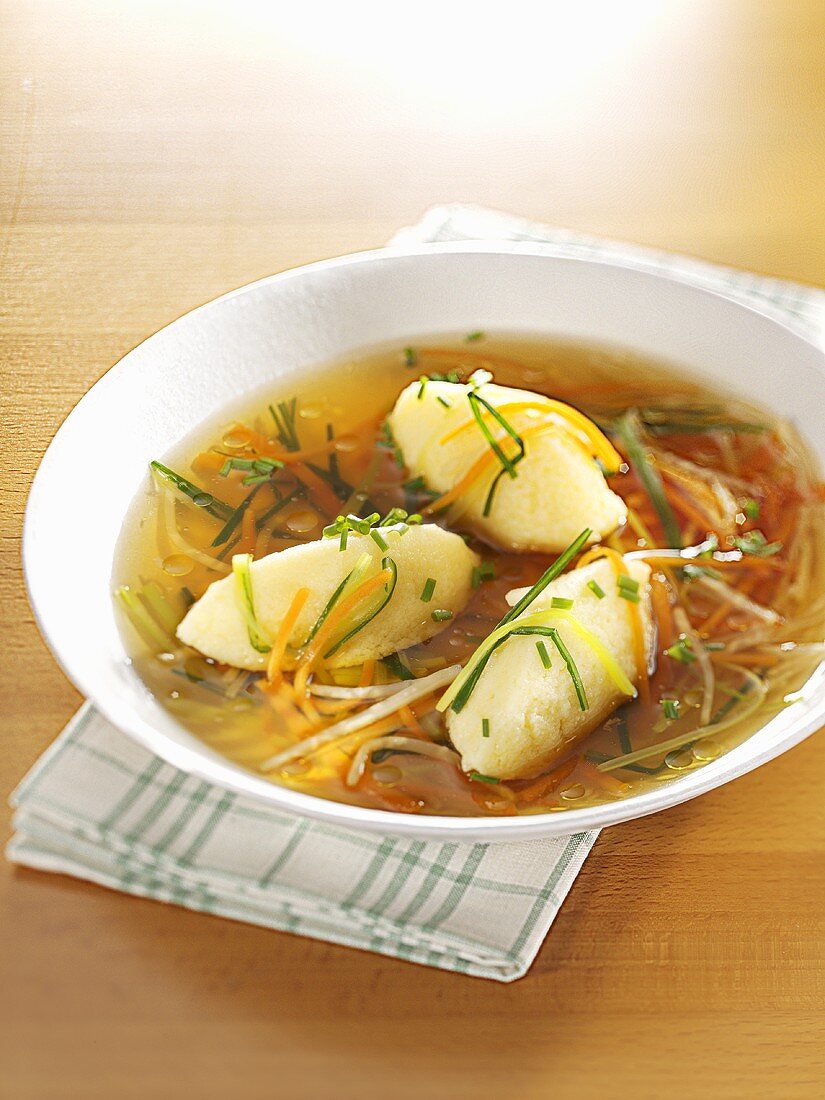 Semolina dumpling soup with shredded vegetables
