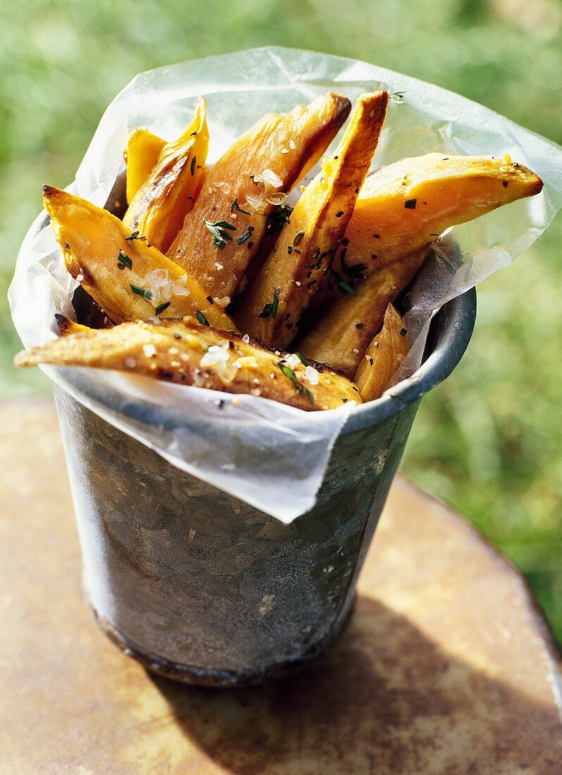 Sweet potato chips with plastic wrap in a beaker
