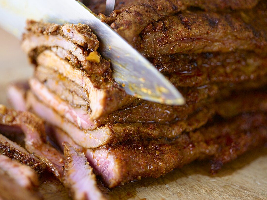 Slicing grilled kebab