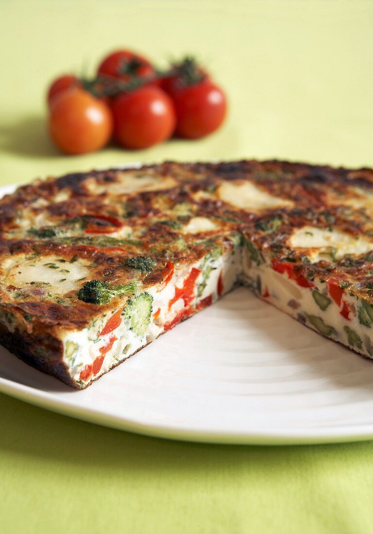 Vegetable frittata, a piece removed