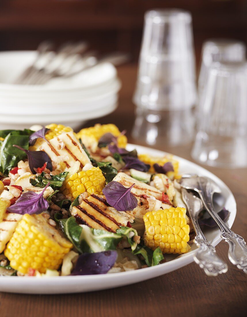 Salad with corn on the cob, grilled halloumi & chilli