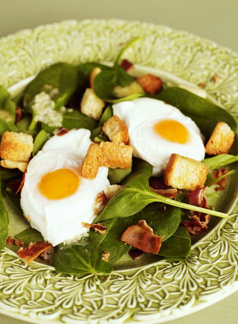 Spinach salad with pancetta, croutons & fried eggs for Easter
