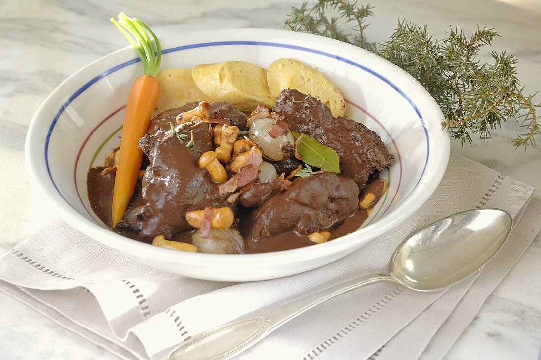 Hasenpfeffer (Hare stew) with pearl onions and mushrooms