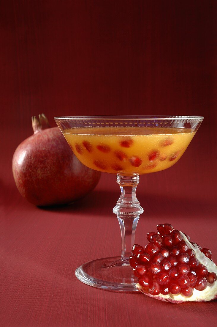 Champagne cocktail with pomegranate seeds