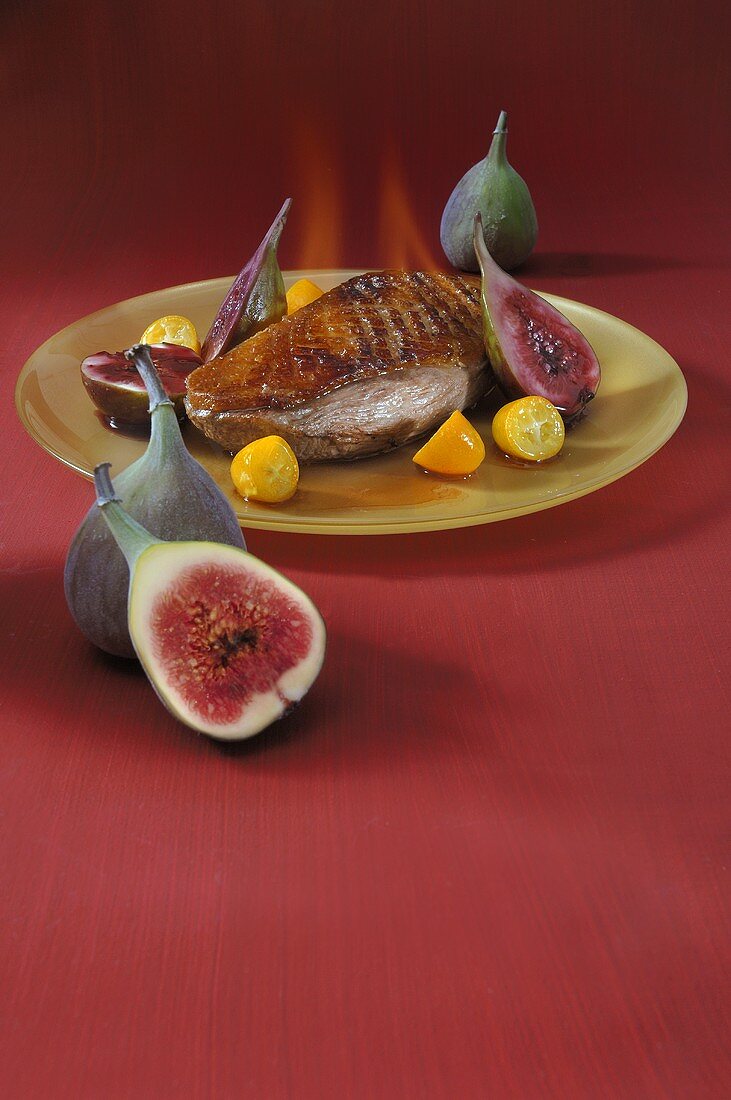Flambéed duck breast with kumquats and figs