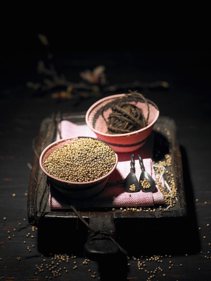 Coriander in a small dish on a wooden bowl