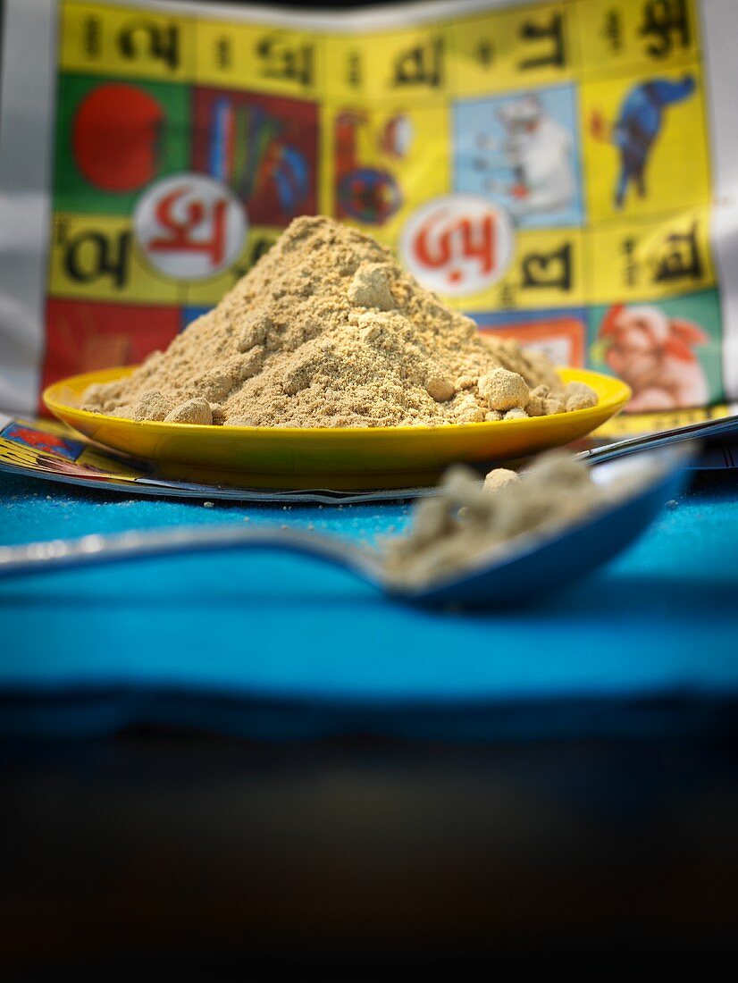 Mango powder (amchoor) on a plate with spoon