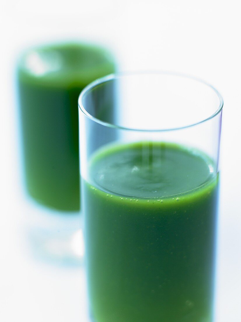 Parsley soup in two glasses