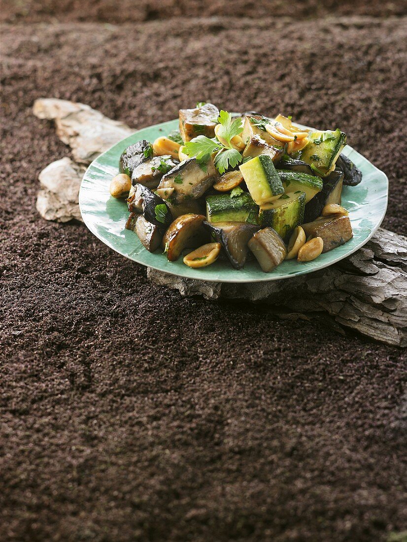 Fried ceps, courgettes and aubergines with peanuts