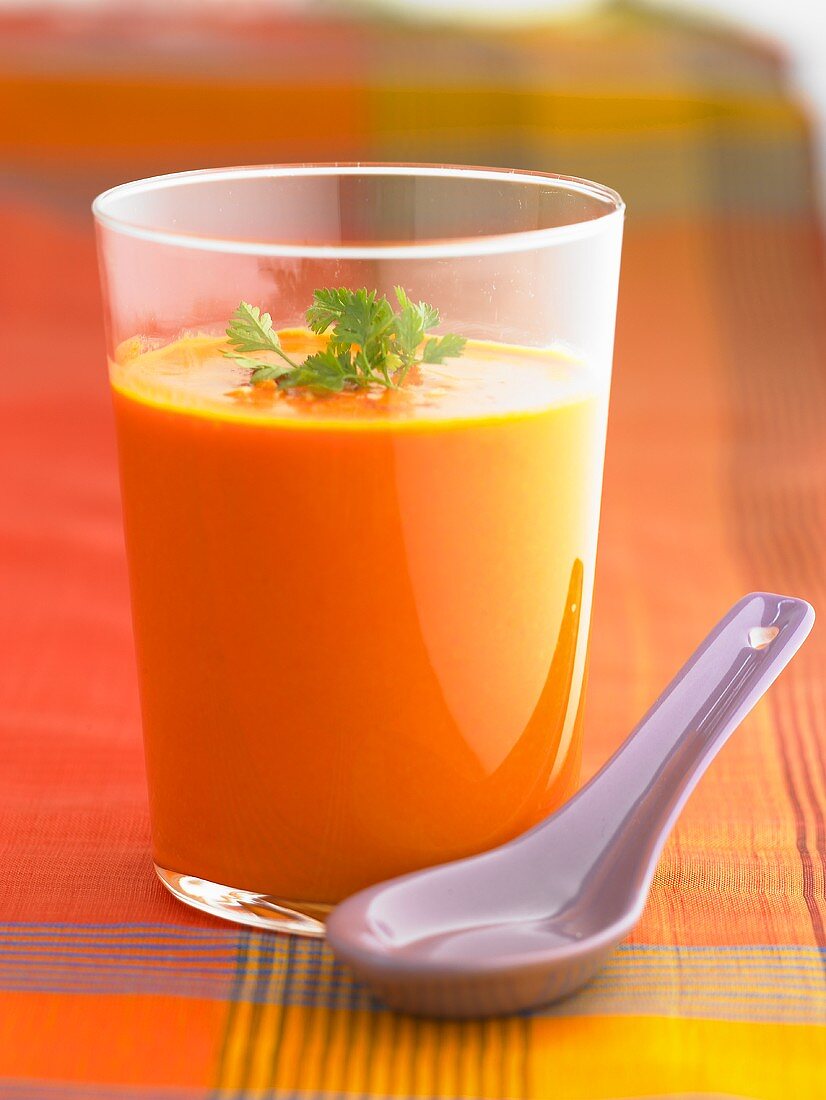 Red pepper and ginger soup in a glass with chervil