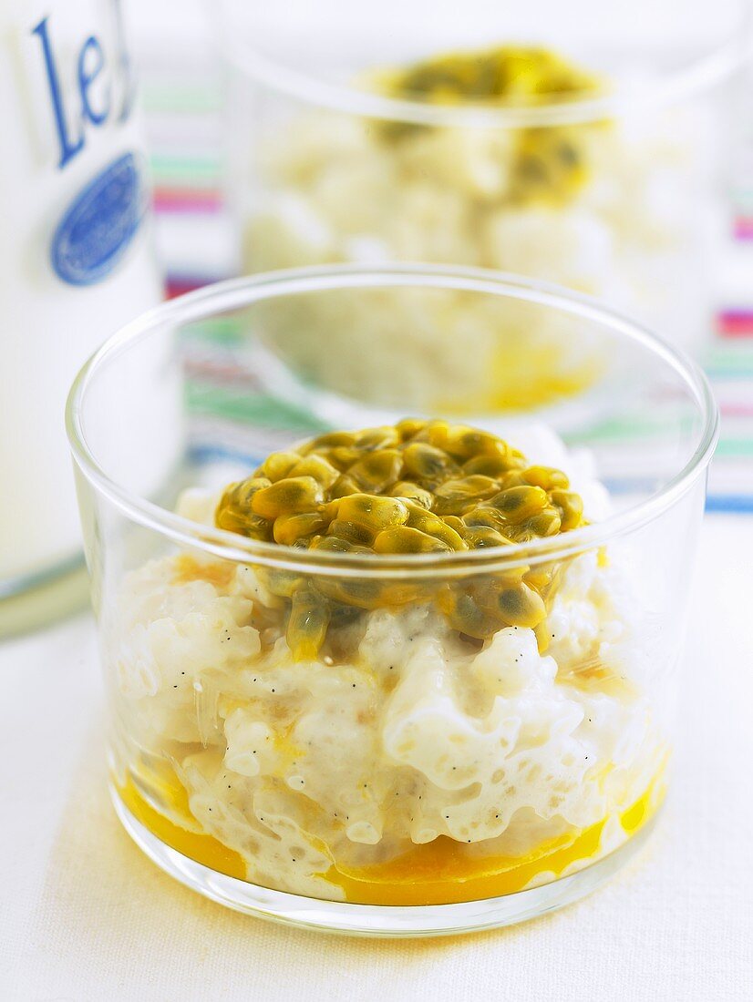 Coconut rice pudding with passion fruit in glasses