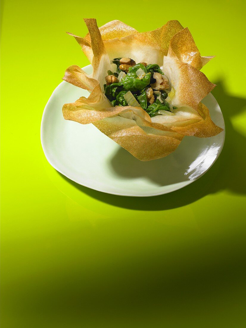 Spinach with walnuts in a brik pastry basket
