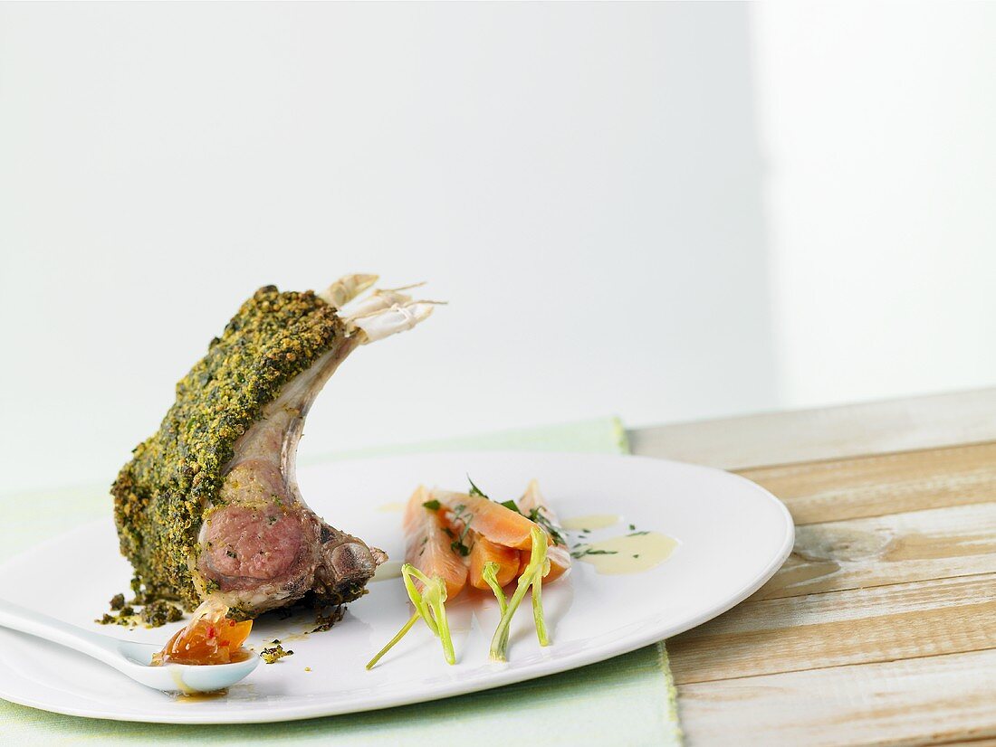 Rack of lamb in herb crust with sweet & sour apricots, carrots