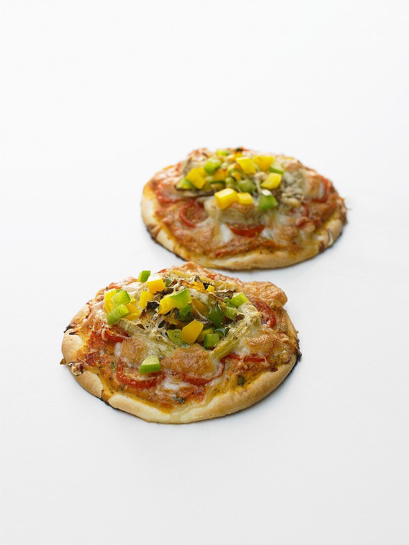 Two small vegetable pizzas