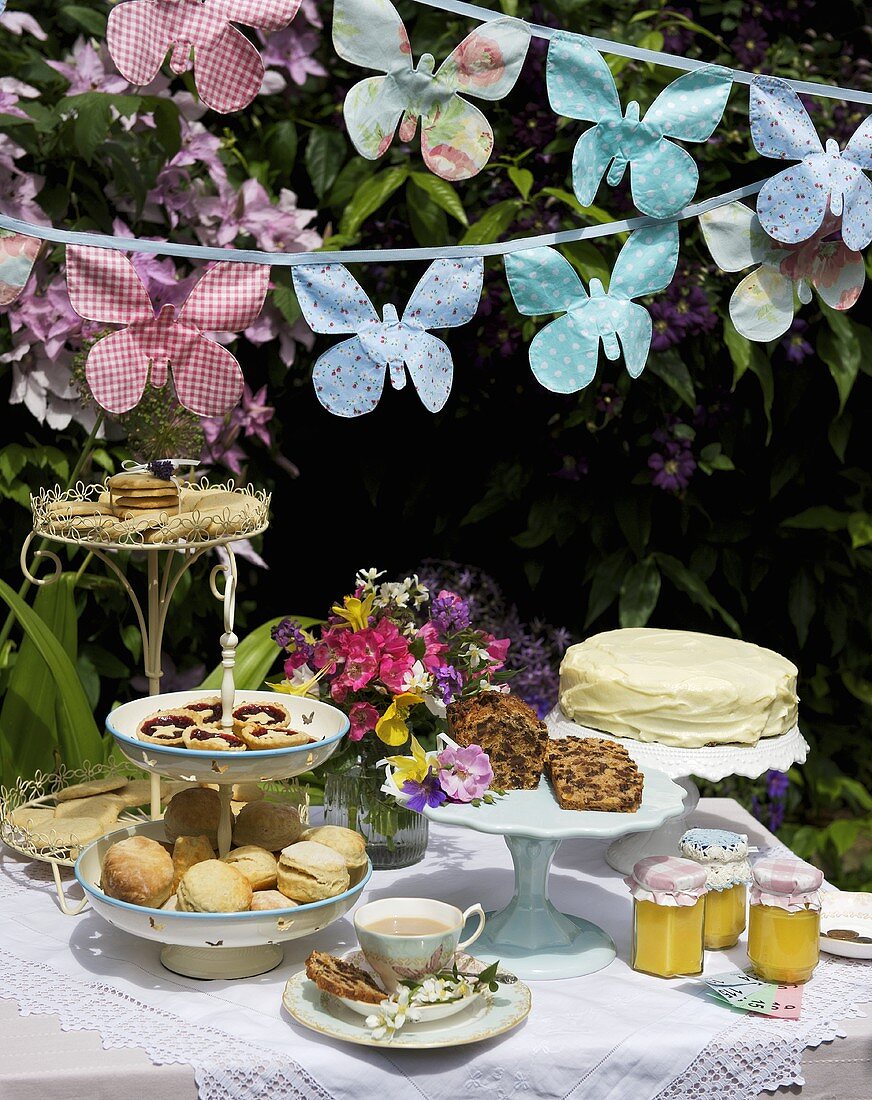 Cakes, scones, biscuits etc. on a table at a garden party