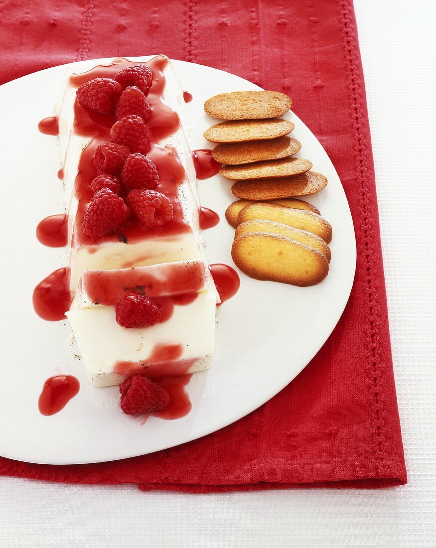 Panna cotta with raspberries, raspberry puree and biscuits