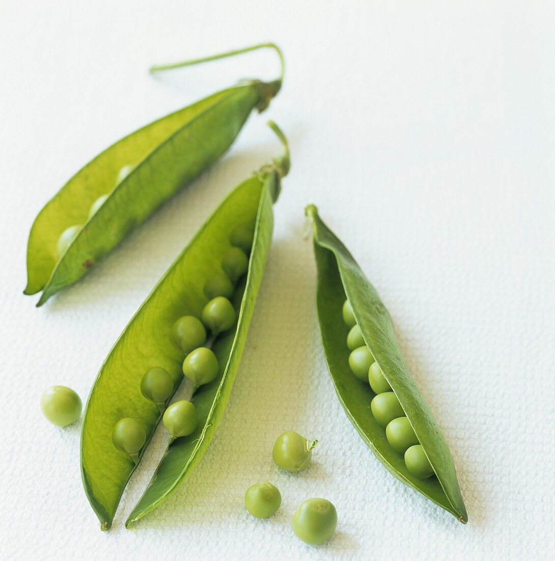 Opened pea pod with peas