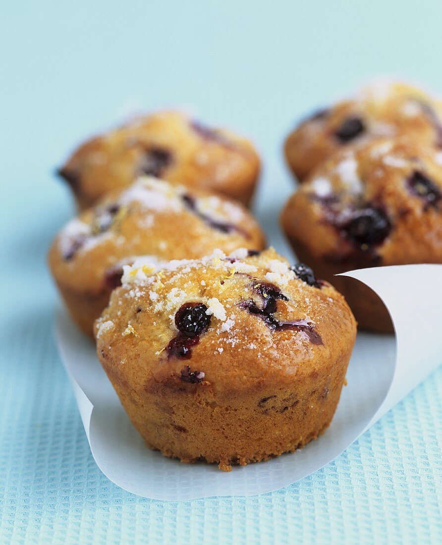 Five blueberry muffins with lemon sugar