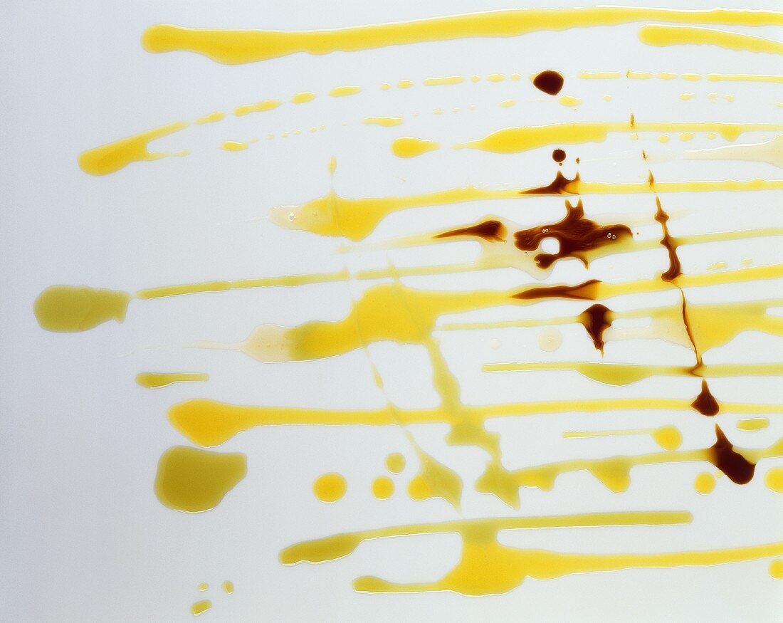 Various types of oil on a sheet of glass