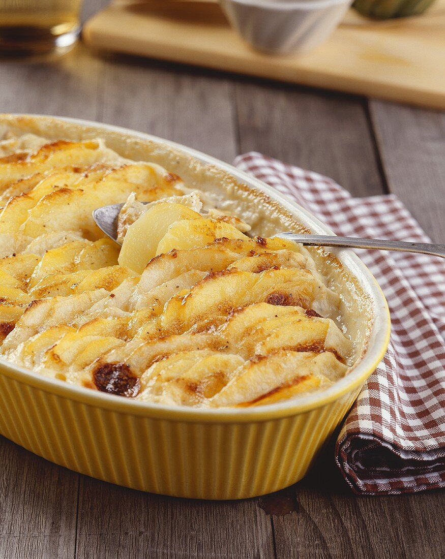 Potato and celeriac gratin in a baking dish