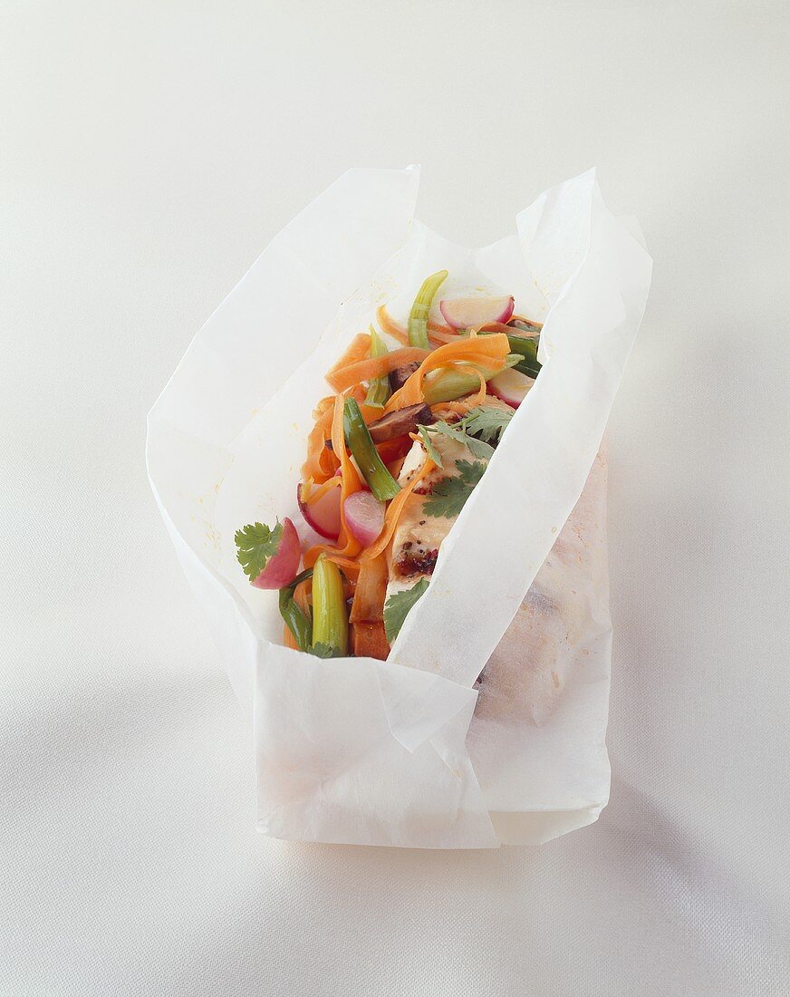 Wasabi chicken breast with vegetables baked in parchment paper