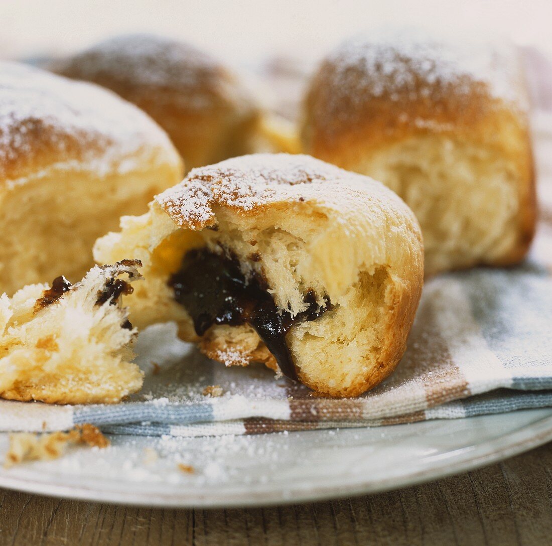 Sweet dumplings with damson filling, dusted with icing sugar