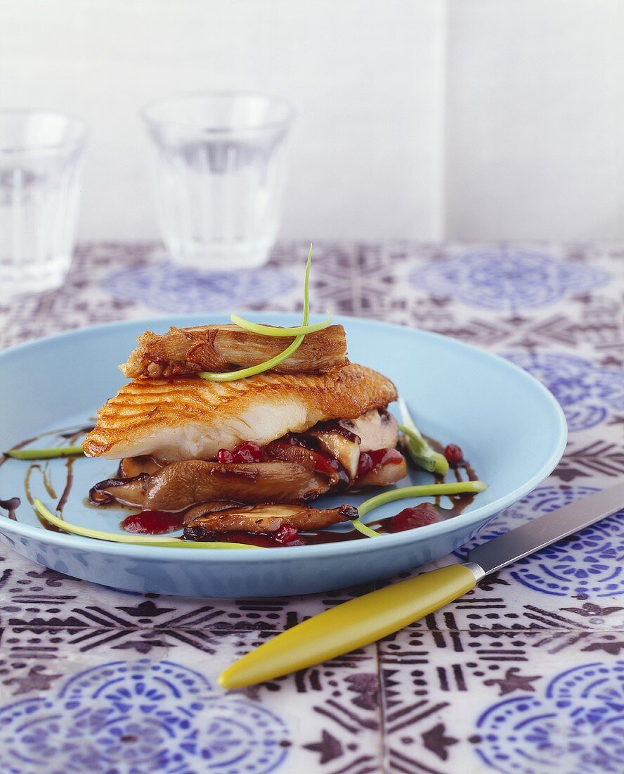 Fried halibut with mushrooms and cranberries