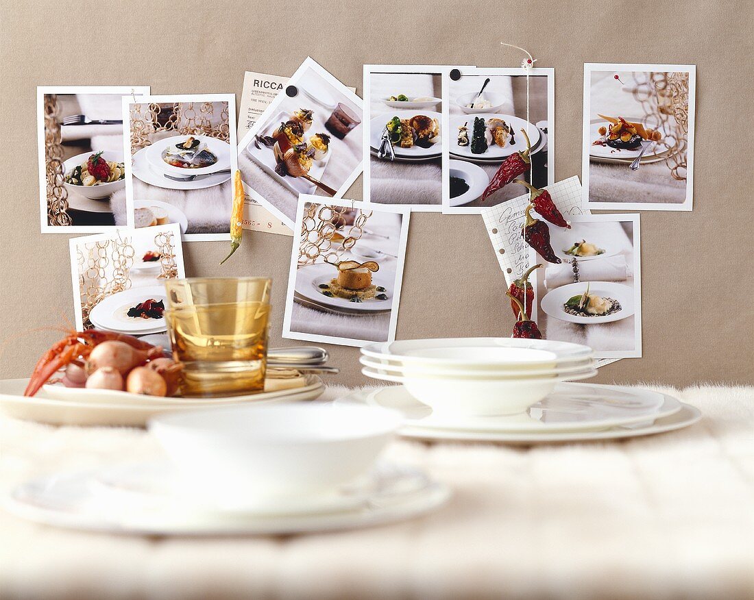 Kitchen still life with crockery and photos on the wall