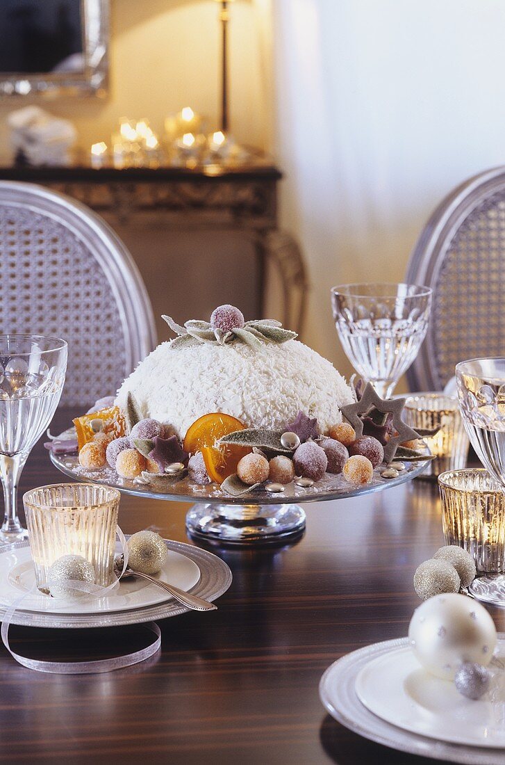 Chocolate and orange dome cake on festive table