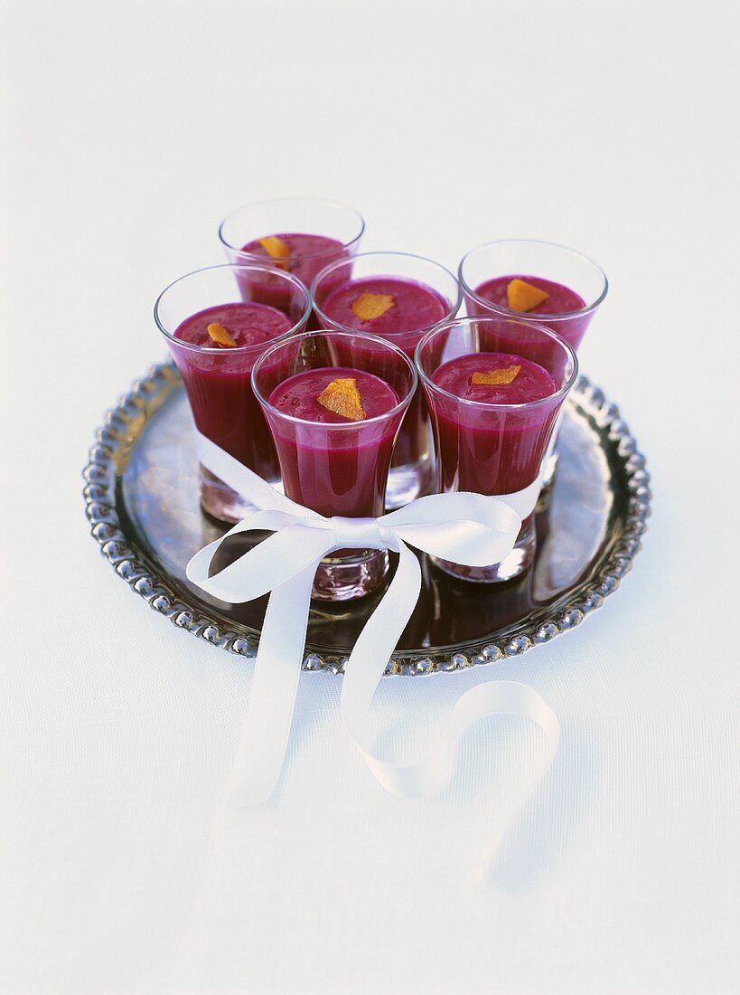 Cold beetroot soup with orange in glasses