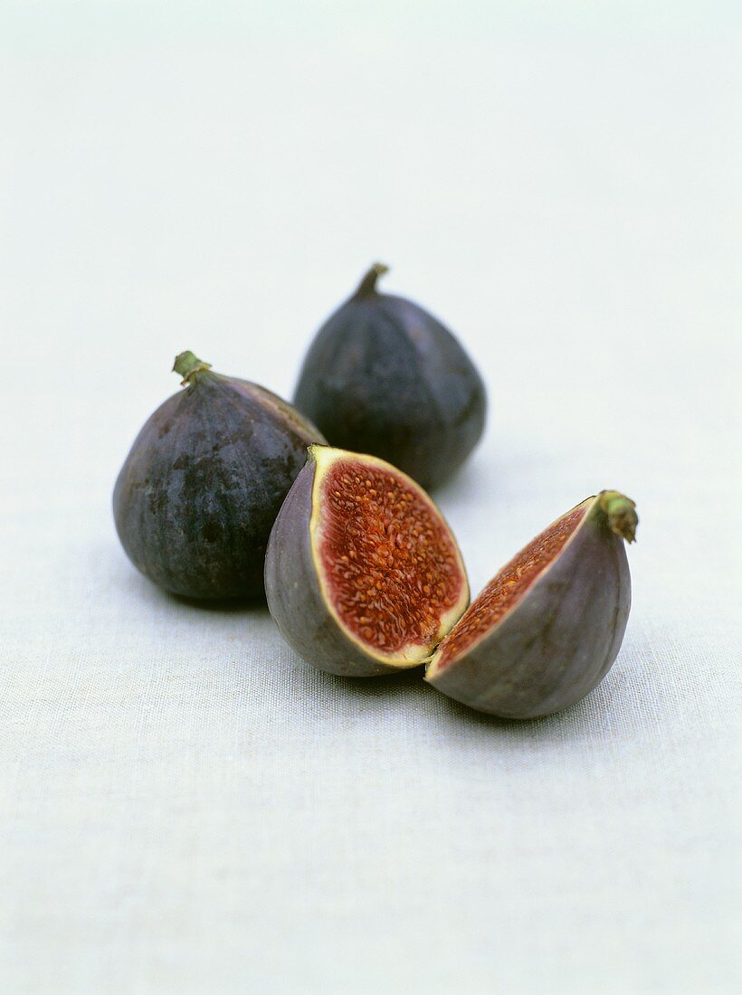 Two whole figs and one halved fig