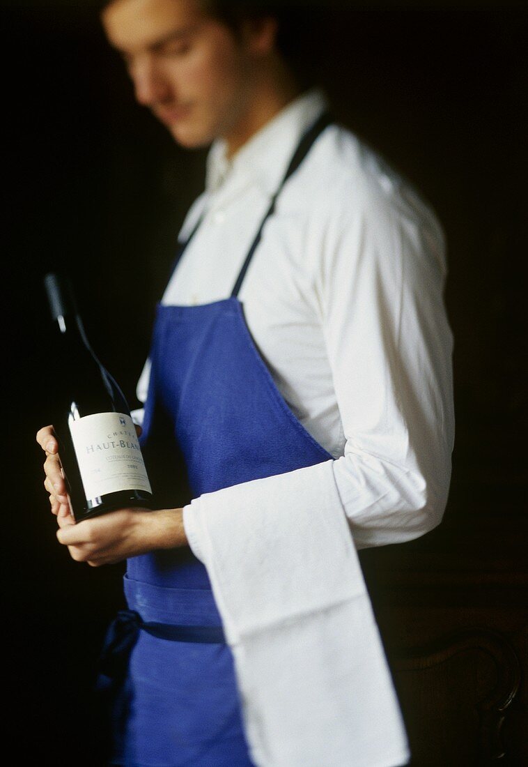Sommelier with a bottle of wine