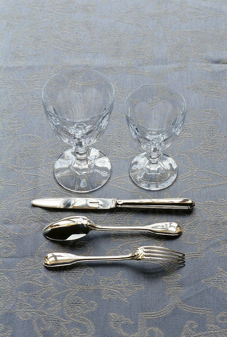 Silver cutlery with two glasses
