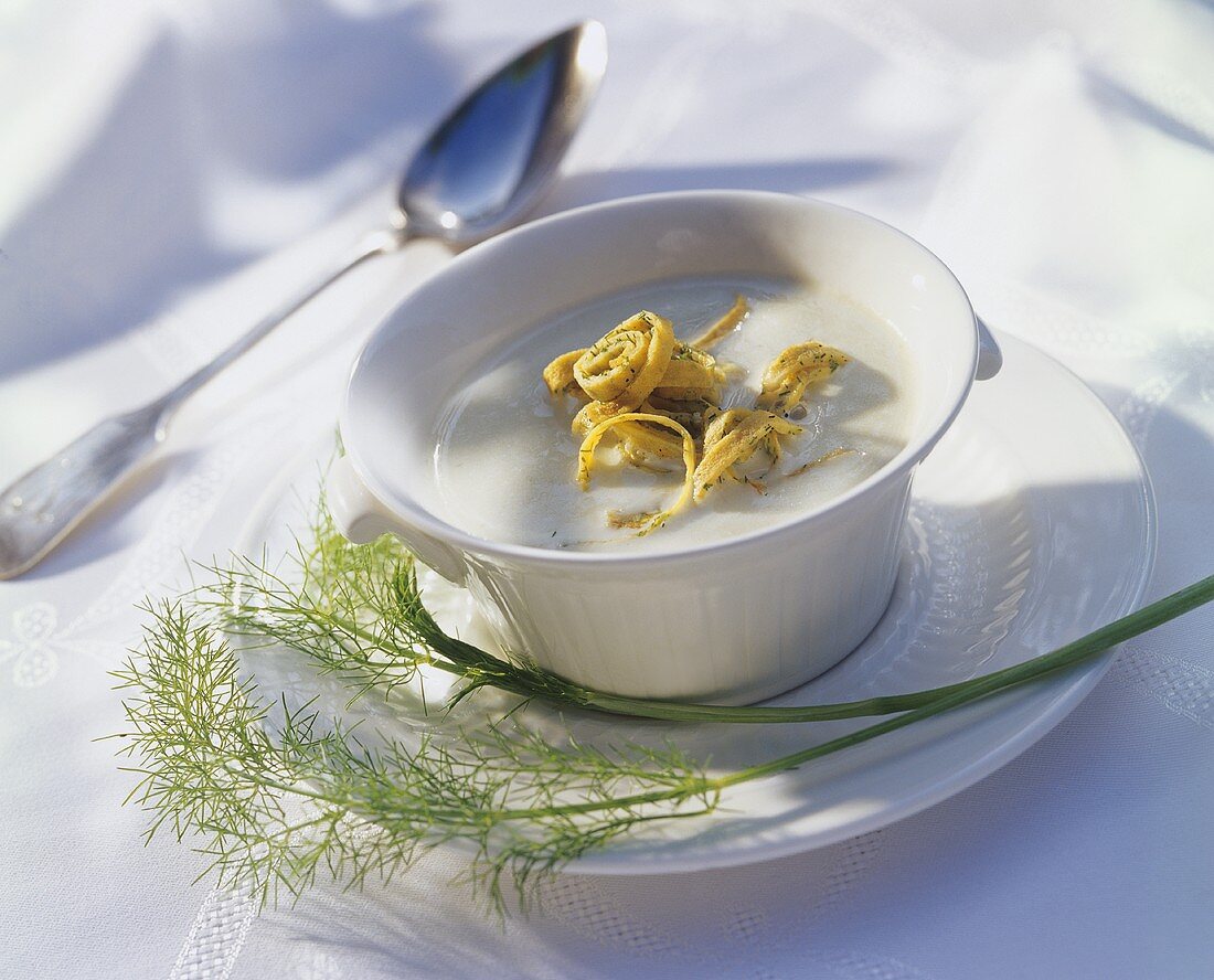 Cream of fennel soup with strips of herb pancake