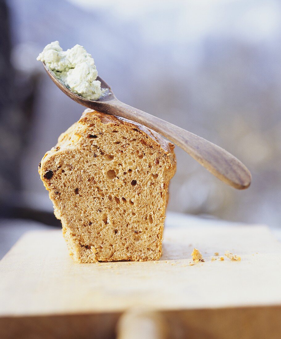 Spelt olive bread with soft cheese and basil spread