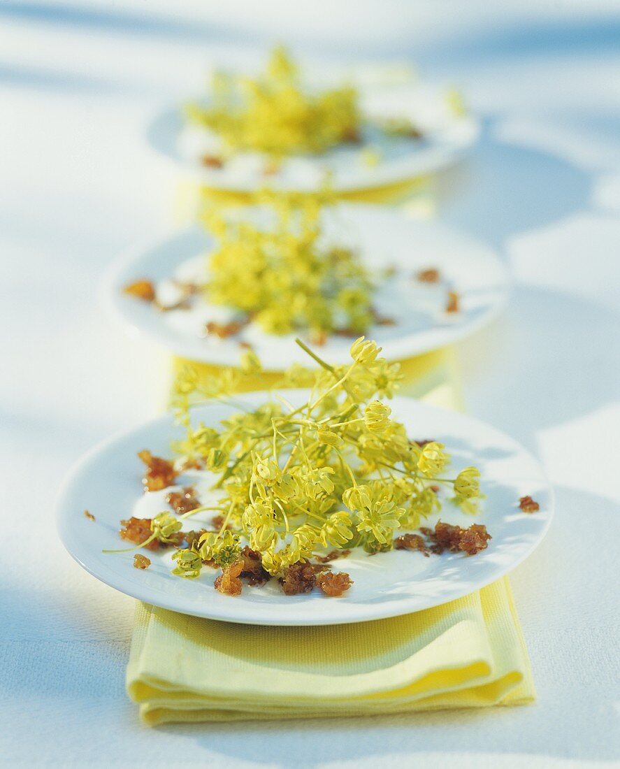 Maple flowers with raisins and yoghurt dressing