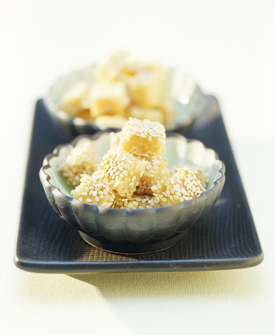 Sesame sweets in two small dishes