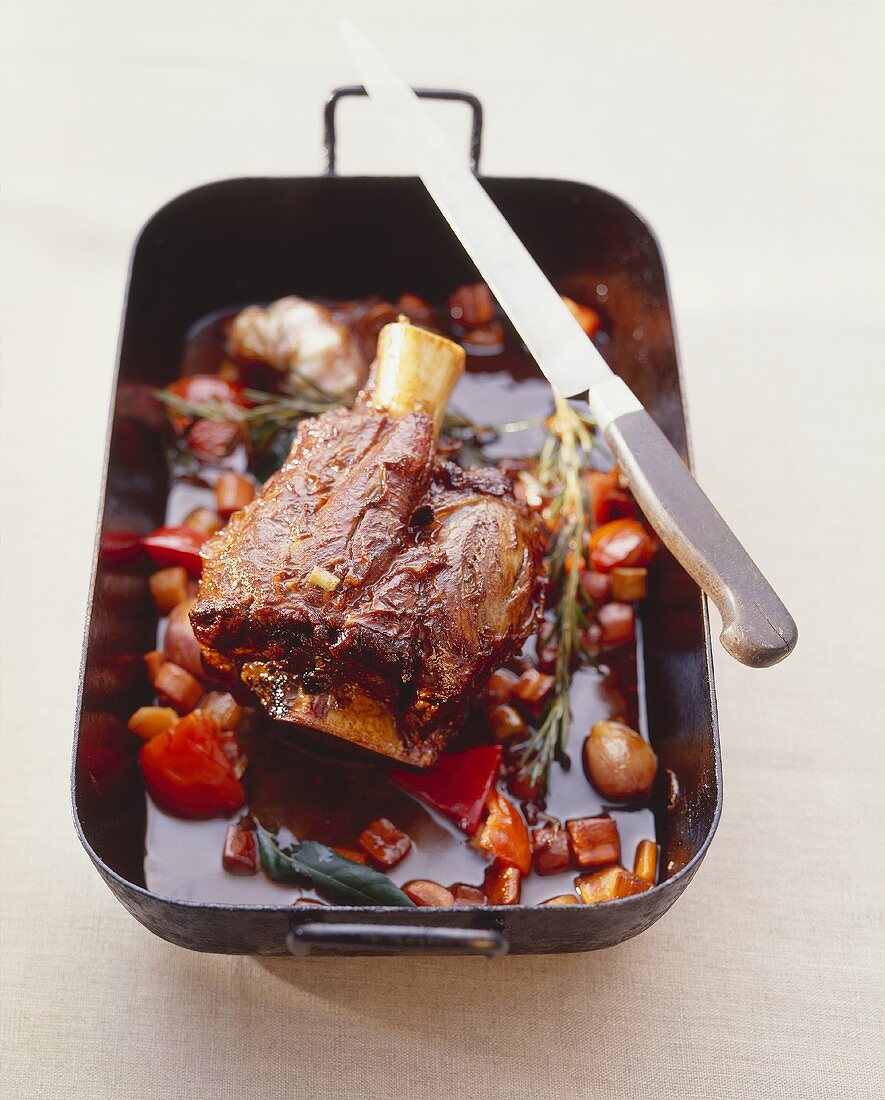 Veal shank with red wine sauce in a roasting tin