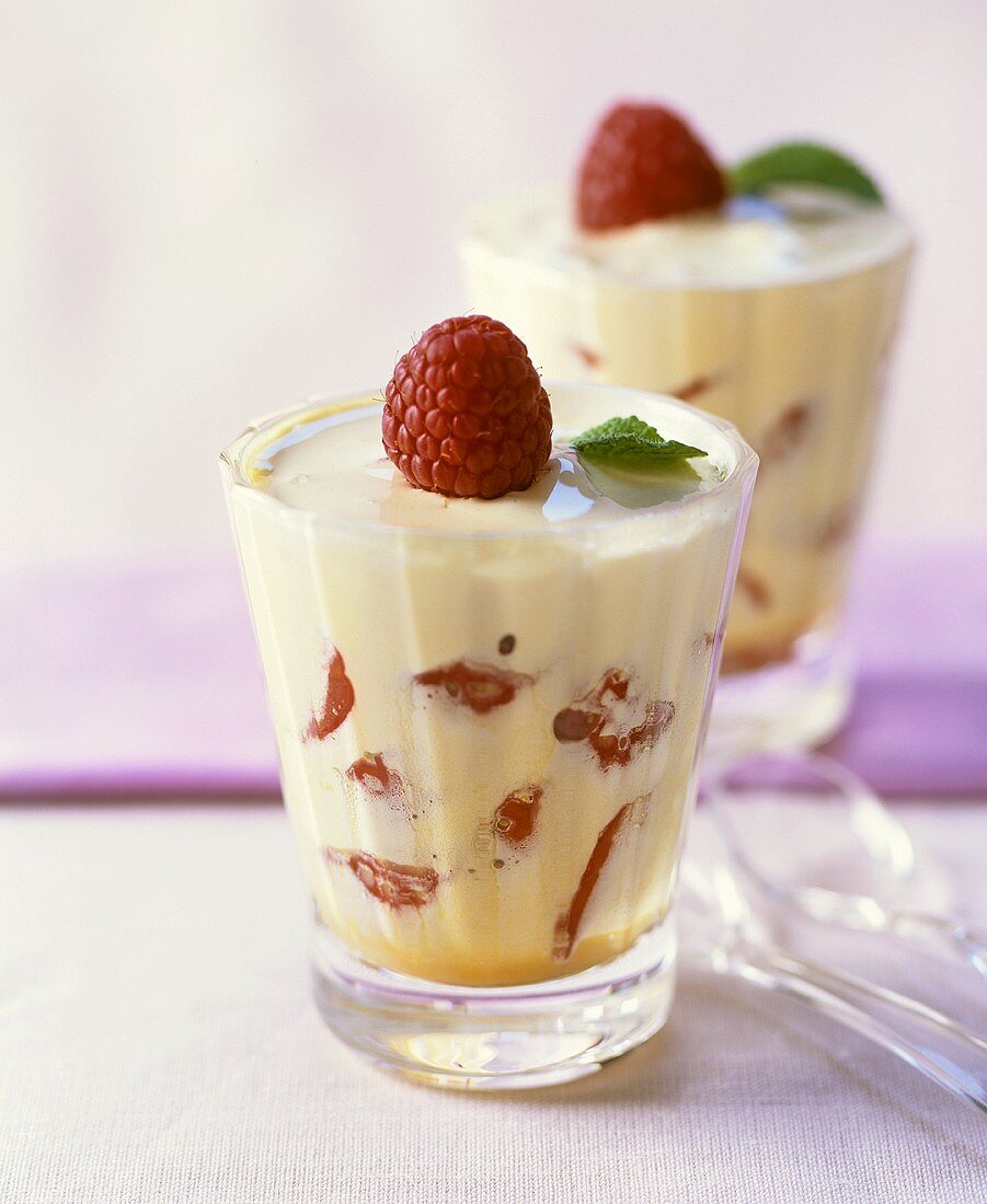 White chocolate cream with fresh berries in two glasses