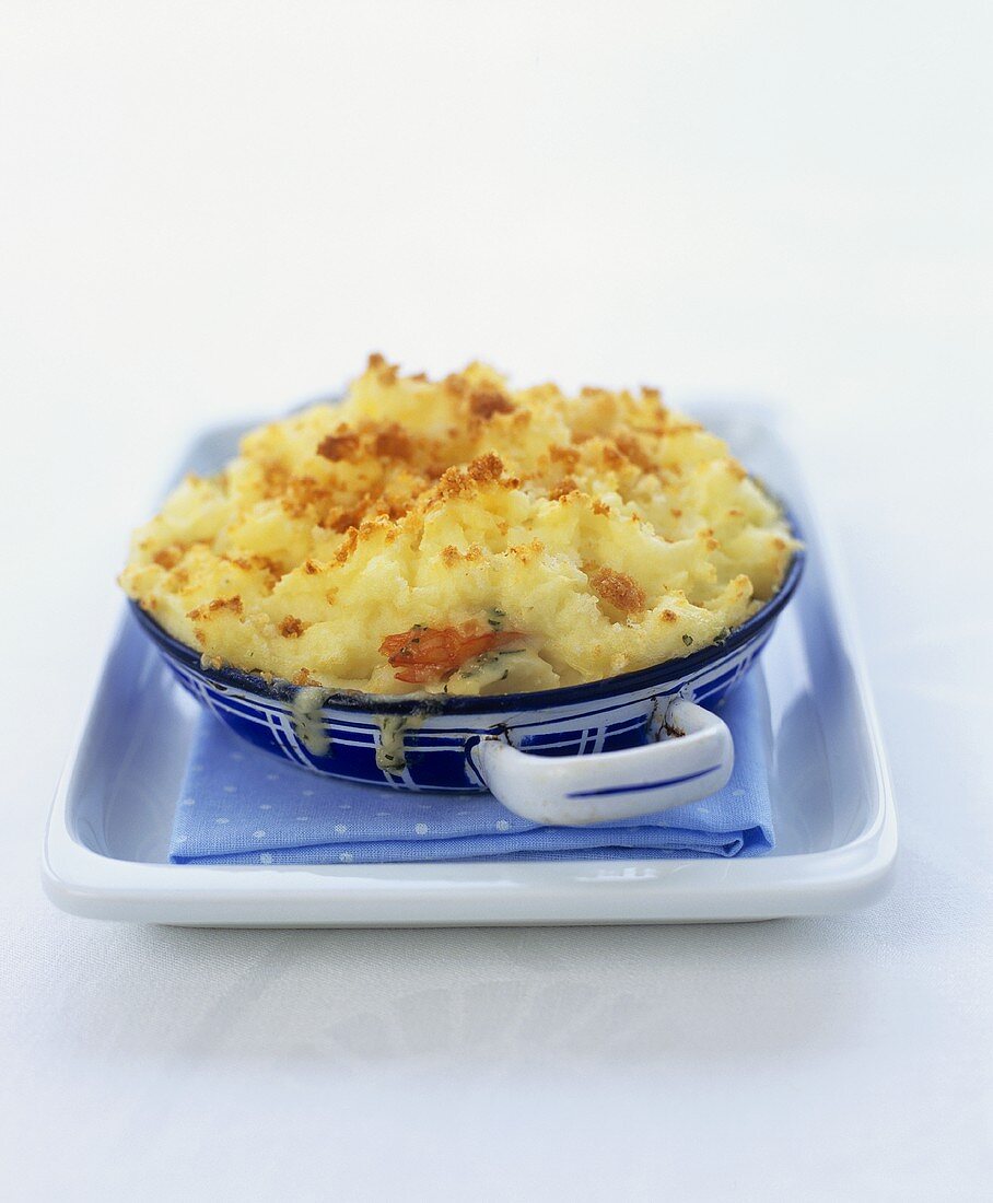 Smoked haddock pie with prawns and mashed potato and parsnip